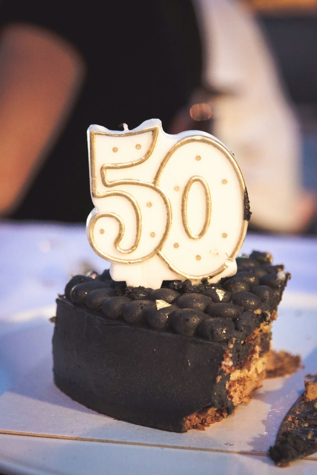A cake celebrates a 50th birthday.